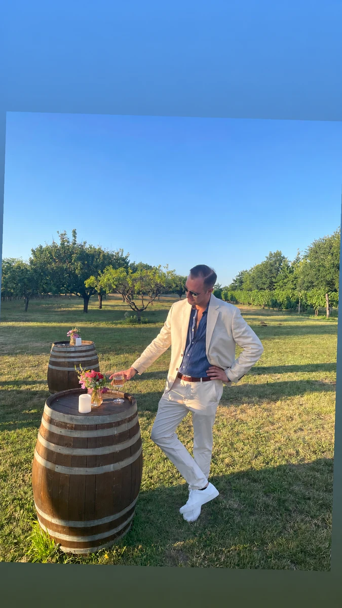 Barna at an outdoor vineyard gathering